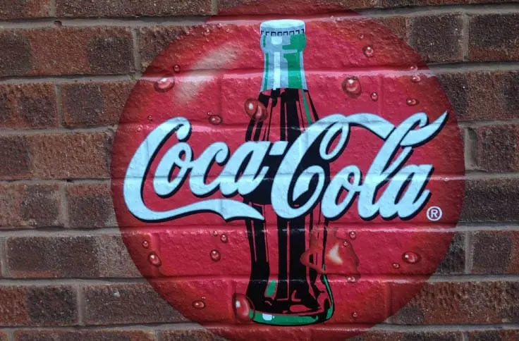 coca cola branding printed on brick wall vinyl and installed by Wallace Print