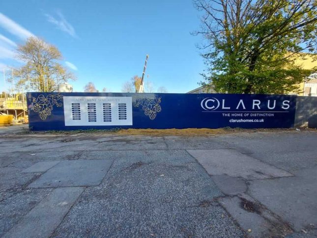 A photo of printed site hoarding panels for Clarus homes