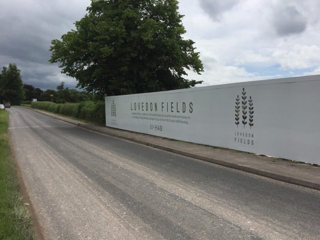 A photo of Hoarding printing for Lovedon Fields - the benefits of printed hoarding are fantastic are hiding unslighlty construction work.