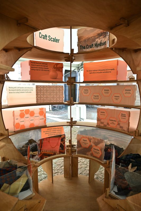 Close-up of Rural Lab circular installation with detailed text and visuals about rural innovation.