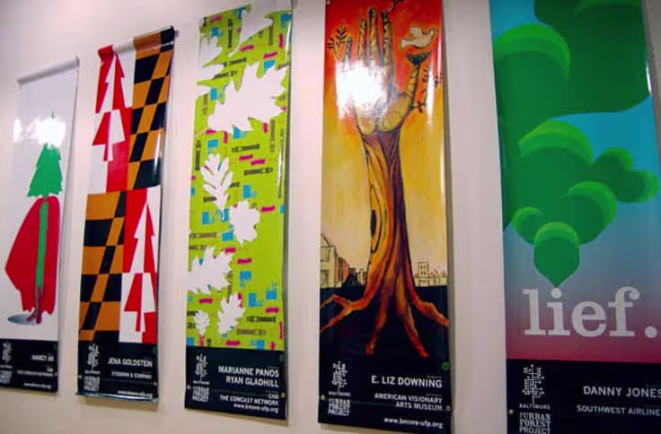 Series of indoor promotional banners displayed along corridor wall