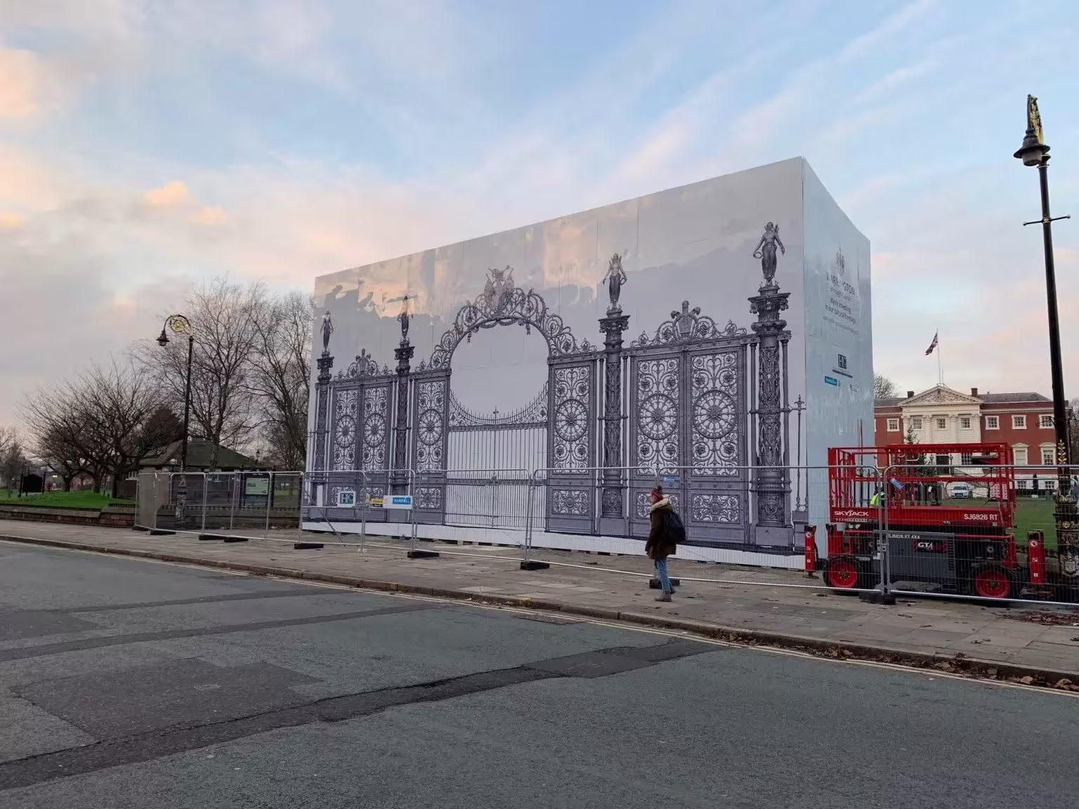 Printed hoarding graphics installed around a construction perimeter fence