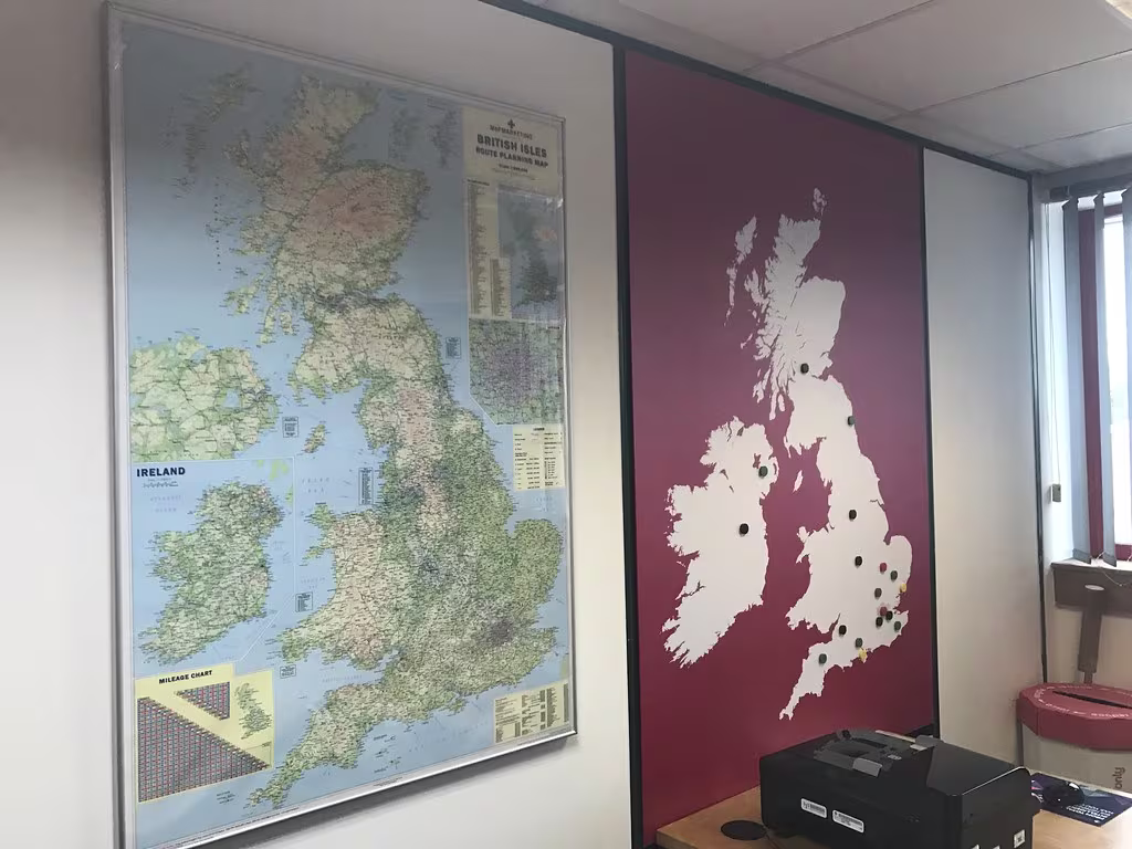 Printed magnetic wall sign showing 14k pallet storage locations for a logistics brand