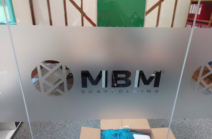 MBM corporate logo manifestation vinyl applied to glazed office partitioning
