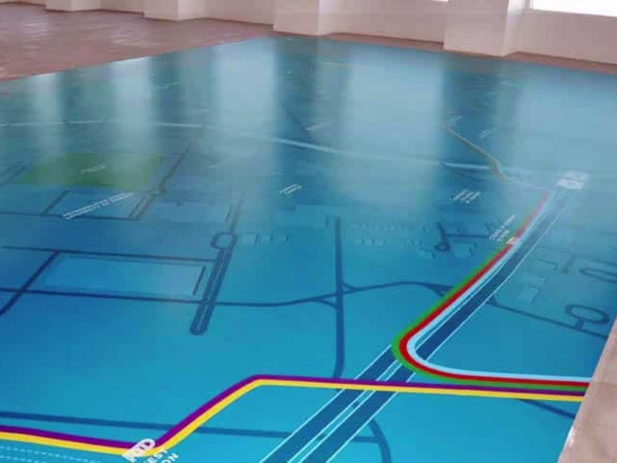 Temporary printed floor vinyl installed around a swimming pool area